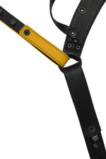 Flat view of lining side of a black and yellow leather jockstrap