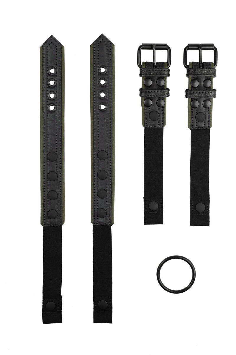 Pair of black and army green leather combat harness connectors with black hardware. Separated. Front view.