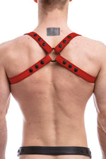 Model wearing red leather shoulder harness back