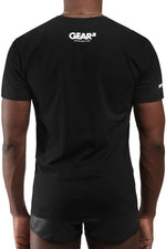 Model wearing black "GEAR SYDNEY" t-shirt. Back view.