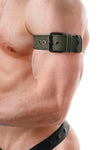 Close-profile view of a male model wearing a 1.5" wide army green leather armband belt with matte black components.