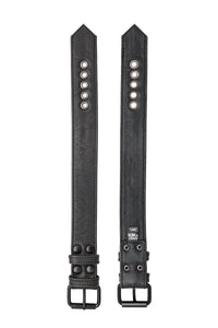 Two 1.5" wide black leather buckled armbands are laid out to reveal both the front details and back leather lining.