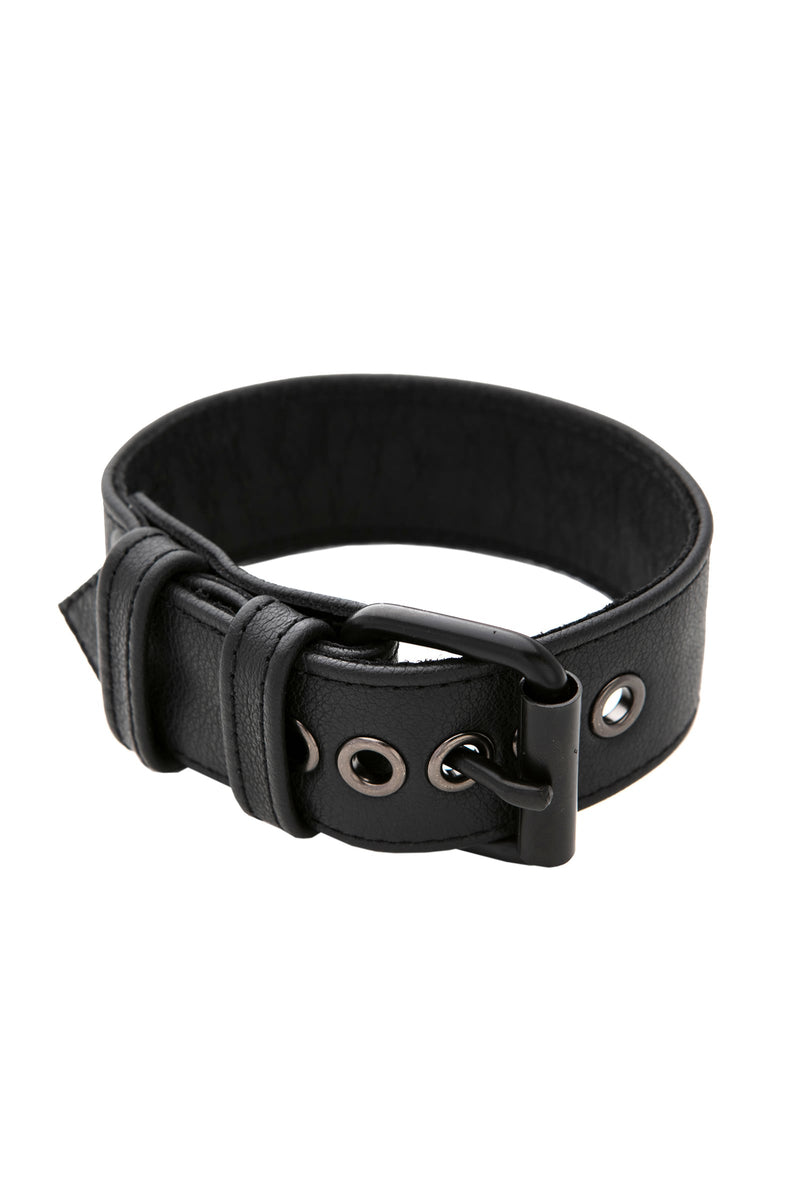 A black leather armband belt with matte black components, coiled into a loop.