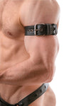 Tight-angled shot of a chiselled model in a black leather armband belt featuring stainless steel details.