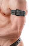 Close-side perspective of a model wearing a grey leather buckled armband with matte black hardware.