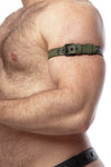 Side zoom-in on a hairy model styled in a  1" wide CLASSIC ARMBELT NARROW - Army Green with matte black hardware.