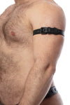 A solid model wearing a 1" wide black leather armband belt turned to show matte black hardware.