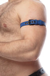 Tight profile shot of a model fitted in a 1" wide blue leather armband belt with matte black buckle.