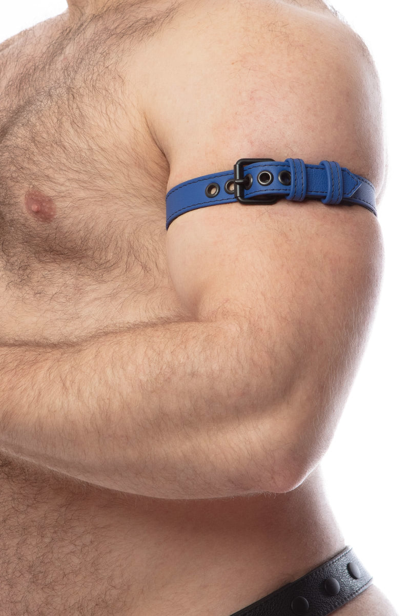 Tight profile shot of a model fitted in a 1" wide blue leather armband belt with matte black buckle.