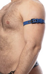 Captured from the side, a model wears a 1" wide blue leather armbelt with matte black hardware.