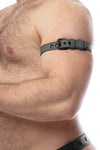 Side zoom-in on a hairy model styled in a 1" wide CLASSIC ARMBELT NARROW - Grey with matte black hardware.