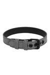 A grey leather buckled armband finished with matte black components, formed into a loop.