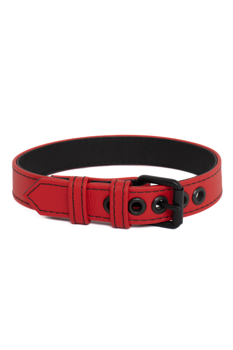Product photo of a 1" wide red leather armband belt with matt black hardware