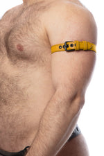 Model wearing a 1" wide yellow leather armband belt with matt black hardware