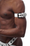 Tight-angled shot of a fit model in a white leather armband featuring matte black details.