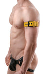A CLASSIC ARMBELT - Yellow featuring matte black hardware styled on a model facing off-camera.