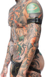 A model turned to the side, styled in a 1.5" wide black and army green leather armband with matte black hardware.