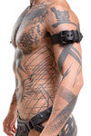 A COMBAT ARMBELT - Black featuring matte black hardware styled on a model facing off-camera.