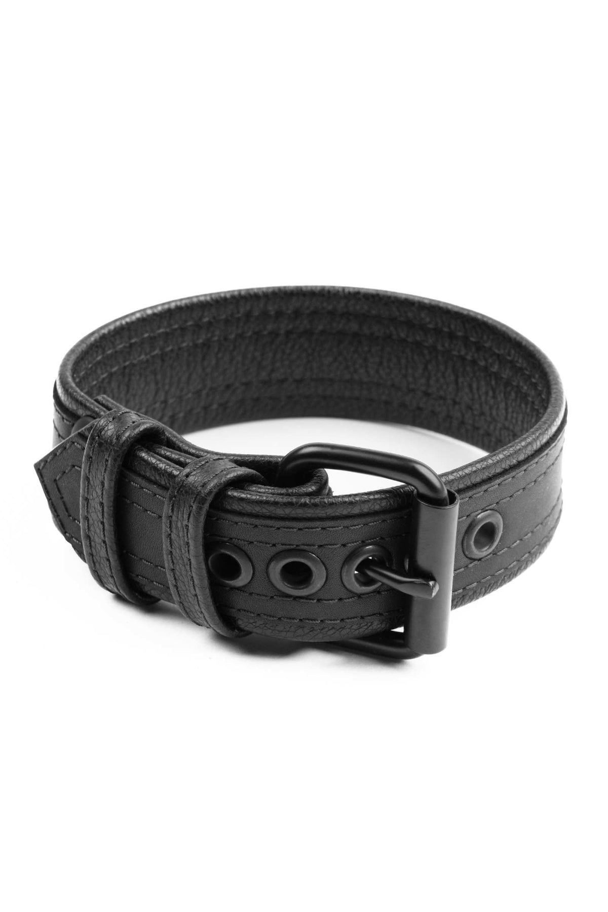 A 1.5" wide COMBAT ARMBELT - Black with matte black hardware standing in a ring shape.