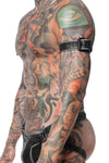 A model facing sideways displays a 1.5" wide black and grey leather buckled armband with matte black hardware.