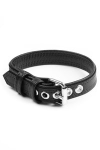 A curled black leather buckled armband with stainless steel components.
