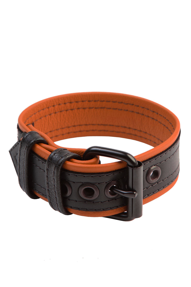 Coiled display of a COMBAT ARMBELT - Orange with matte black hardware.