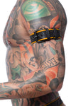 Zoomed shot of a male model from the side, dressed in a 1.5" wide COMBAT ARMBELT - Yellow with a matte black buckle.