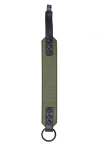 Flat-fronted display of a 2" wide army green and black leather armband featuring matte black components.