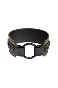 An army green and black leather armband with matte black components, coiled into a loop.