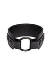 A 2" wide black leather armband with matte black snaps, looped into a ring.