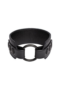 A 2" wide black leather armband with matte black snaps, looped into a ring.