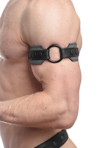 Zoomed shot of a male model from the side, dressed in a 2" wide O-RING ARMBAND - Grey with a matte black O-ring.