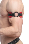 Detailed side view of a model wearing an O-RING ARMBAND - Red finished with matte black hardware.