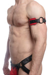A red and black leather armband featuring a matte black O-ring styled on a male model, profile view.