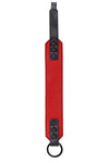 Flat-laid shot of a 2" wide O-RING ARMBAND - Red finished with matte black hardware.