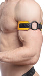 Profile close-up showing a model in a yellow and black leather armband detailed with matte black hardware.