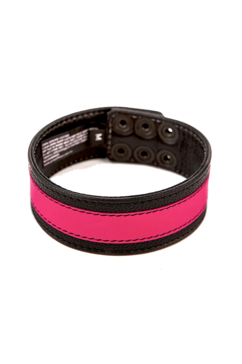 A black and fluro pink leather armband with matte black hardware is shown in a curl.