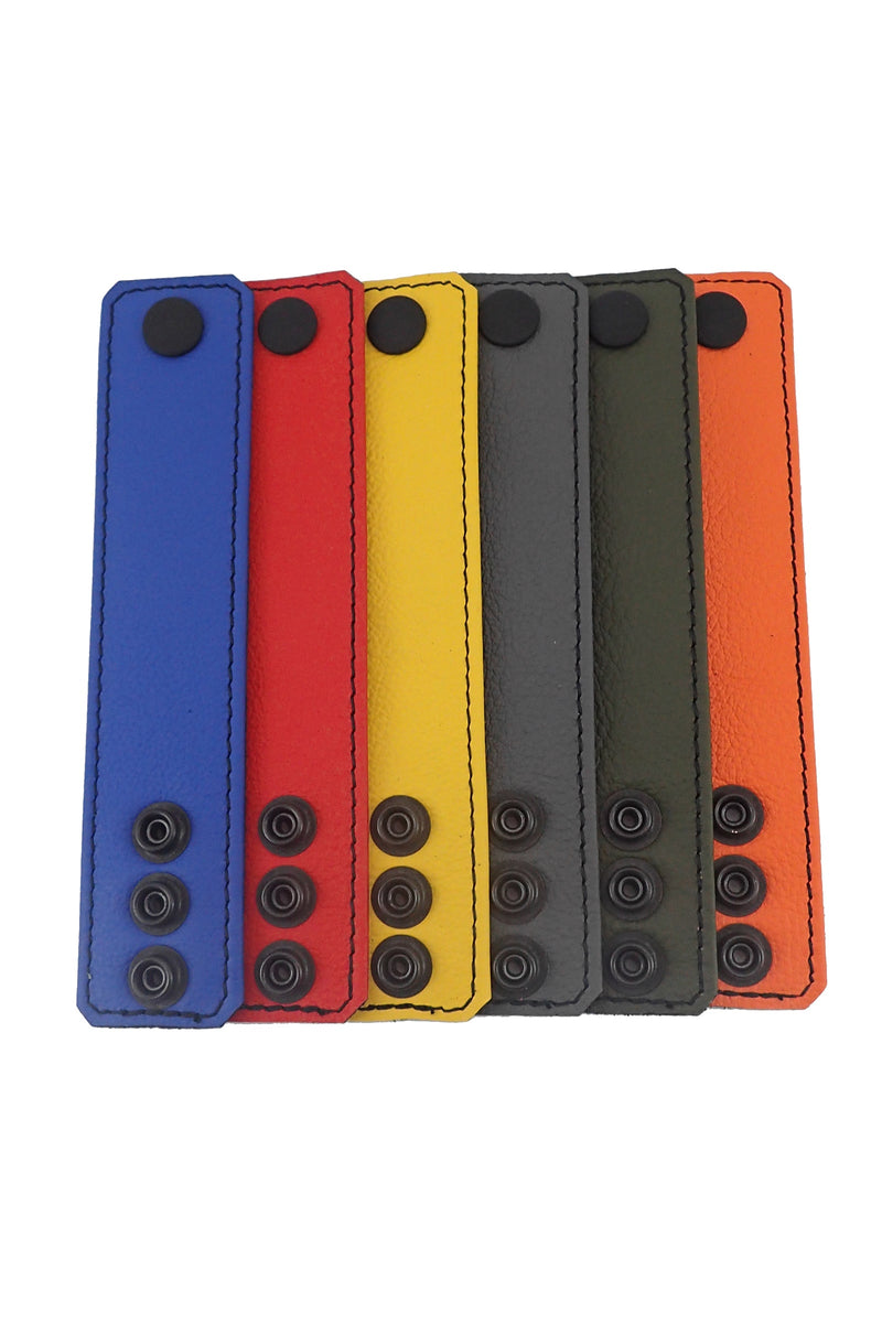 Six Australian-made 1.5" wide ARMY OF MEN BALL STRETCHER NARROW - Colour, with matte black snaps, displayed flat.