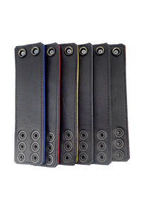 Laid out neatly, six coloured ball stretchers revealing their black leather lining.