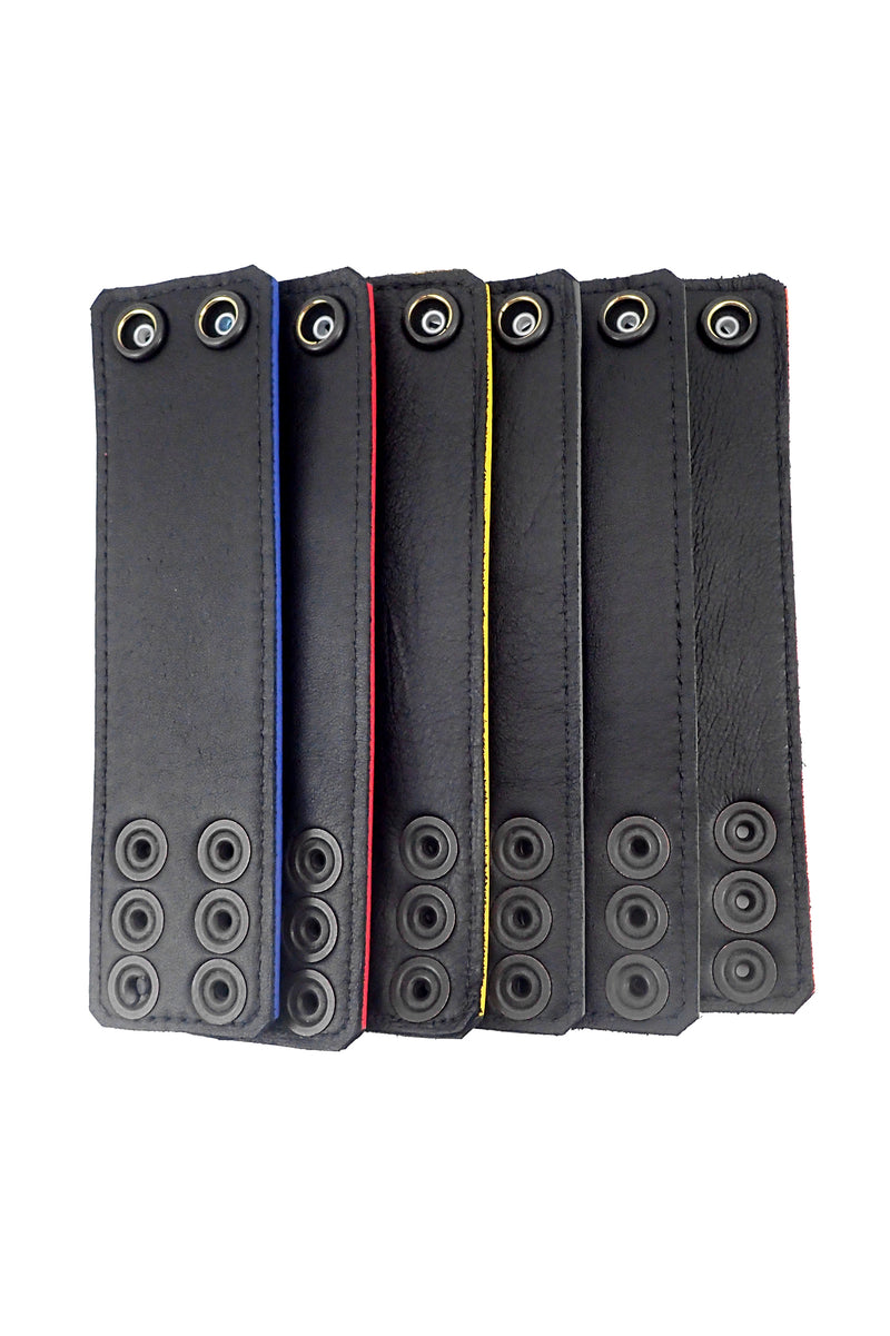 Laid out neatly, six coloured ball stretchers revealing their black leather lining.