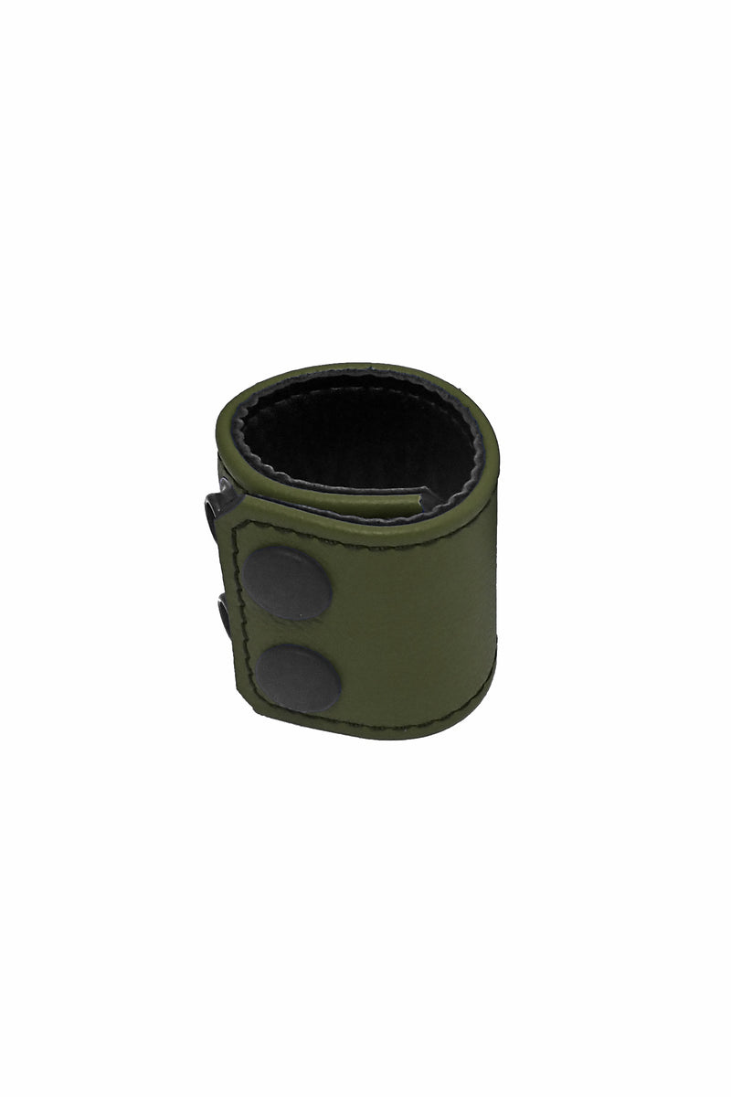 An army green leather ball stretcher finished with matte black components, formed into a loop.