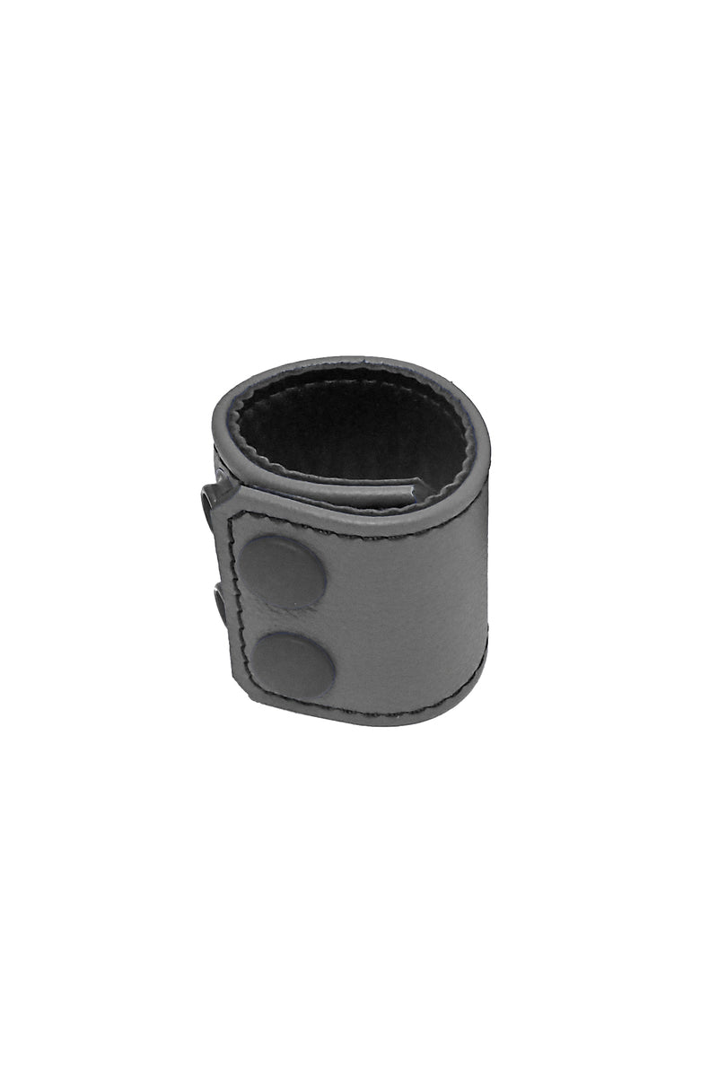 Coiled display of a 2" wide grey leather ball stretcher detailed with matte black hardware.