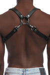 A fit model turned away wearing a 1" wide leather UNIVERSAL BRACES with stainless steel hardware, worn as a shoulder harness.