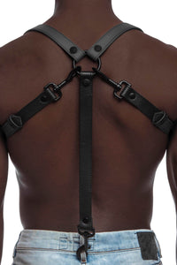 A defined model in a 1" wide ARMY OF MEN UNIVERSAL BRACES - Grey with matte black hardware attached to jeans, back view.
