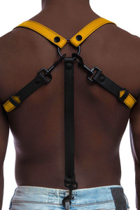 Male model wearing a 1" wide ARMY OF MEN yellow leather braces with matte black hardware, back view.