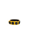 A yellow leather cockring finished with matte black components, formed into a loop.