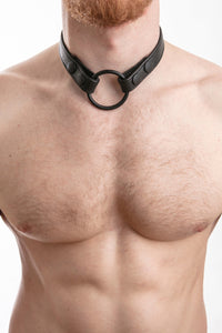 Model wearing black leather cockring strap