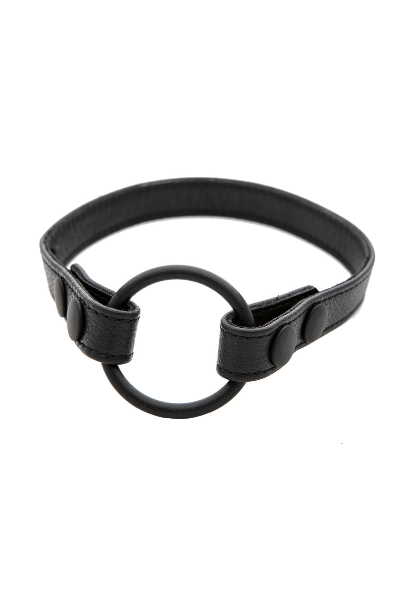 Black leather cockring strap in a ring