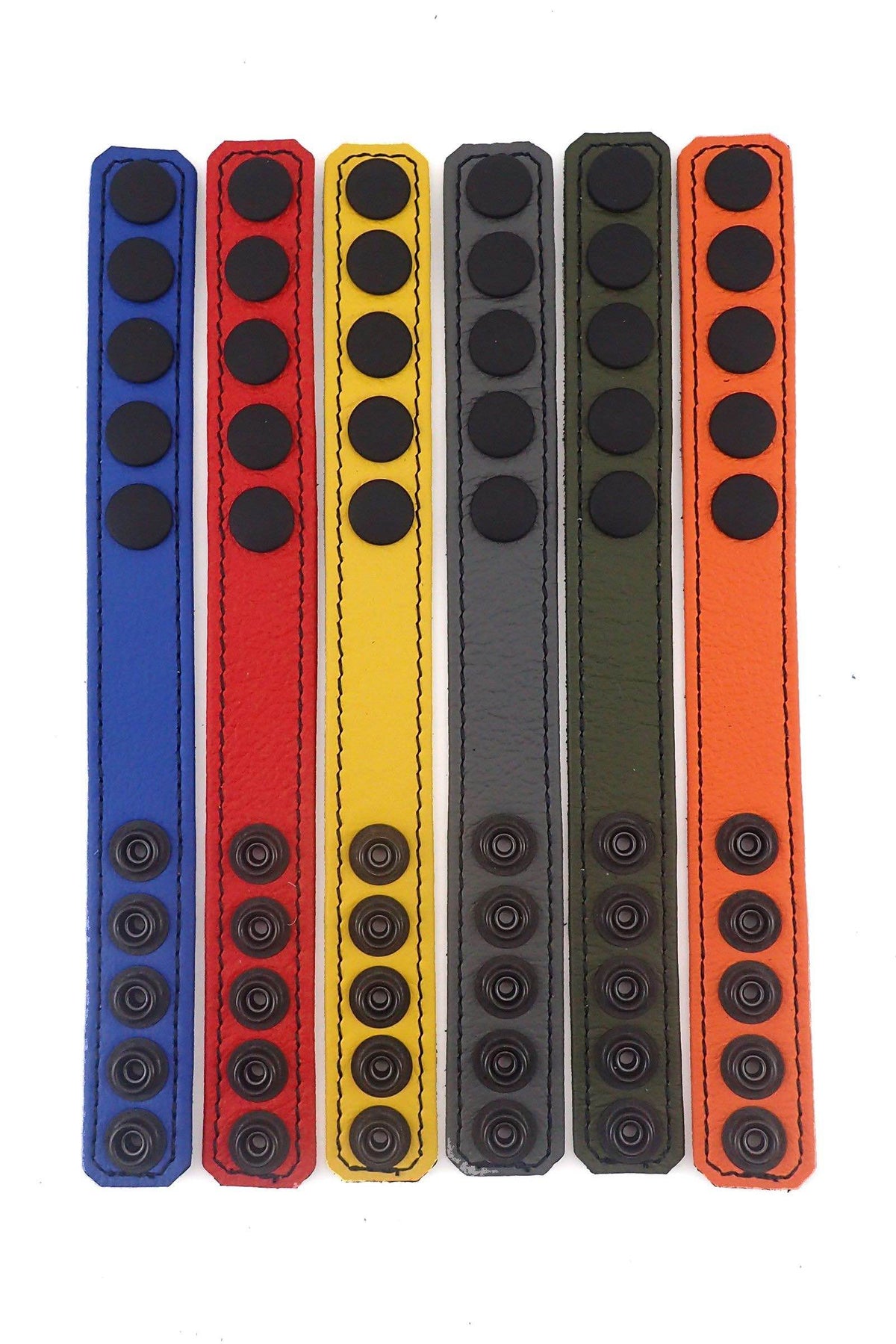 Six 1" wide ARMY OF MEN COCKRING WIDE - Colour, with matte black snaps, laid flat showing the coloured fronts.