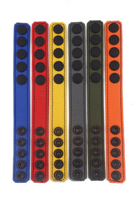 Six 1" wide colour leather cockrings with matte black hardware shown from the front.